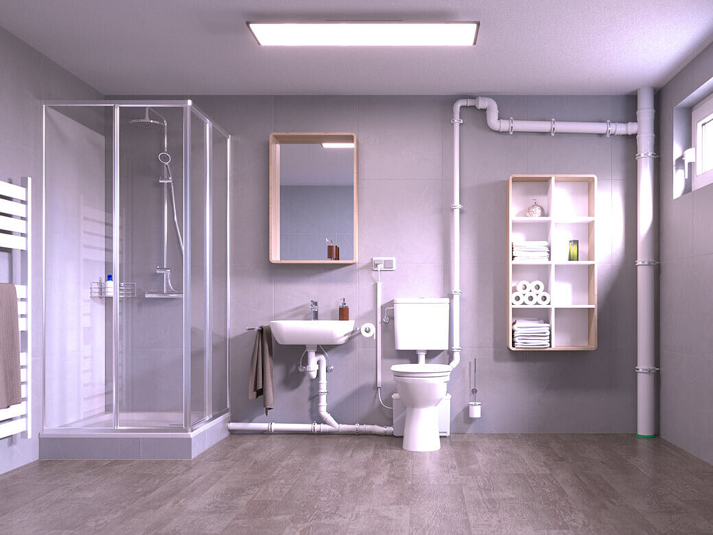Einbaudarstellung Kleinhebeanlage Minilift M WC Kellerraum mit nachgerüsteter Toilette und einer Dusche, die über eine Kleinhebeanlage entwässert werden, die hinter dem WC steht.