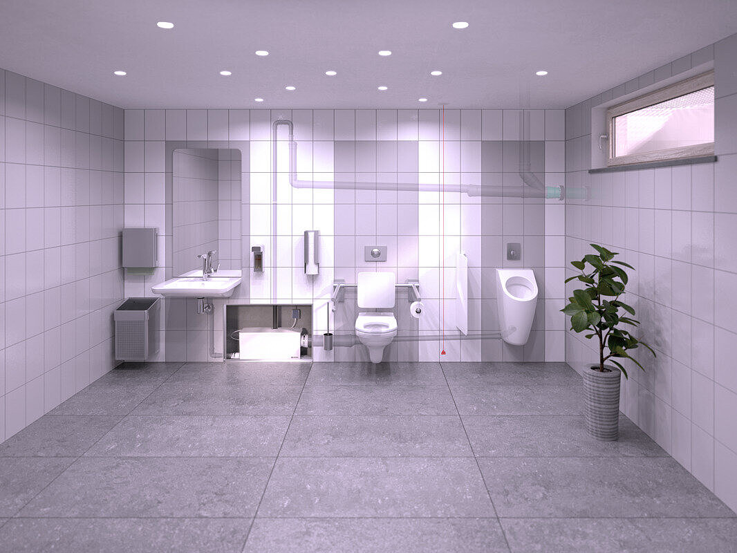 Einbaudarstellung eine Gaststättentoilette im Keller, in der ein Waschbecken, ein Urinal und eine Toilette an die Kleinhebeanlage Minilift L WC Duo angeschlossen sind, die sich in einer Vorwandinstallation verbirgt.